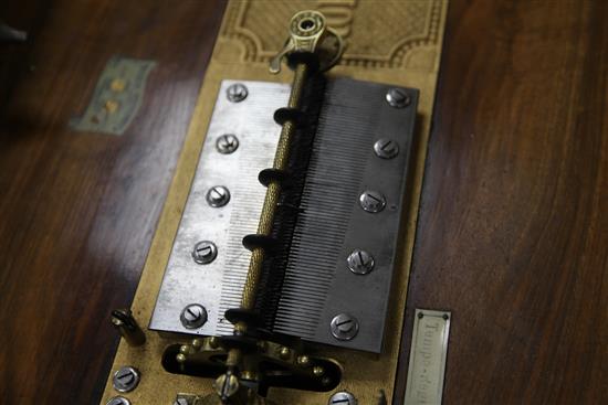 A 19th century walnut cased Polyphon musical box, with thirty six 15.5 inch discs, width 21.5in.